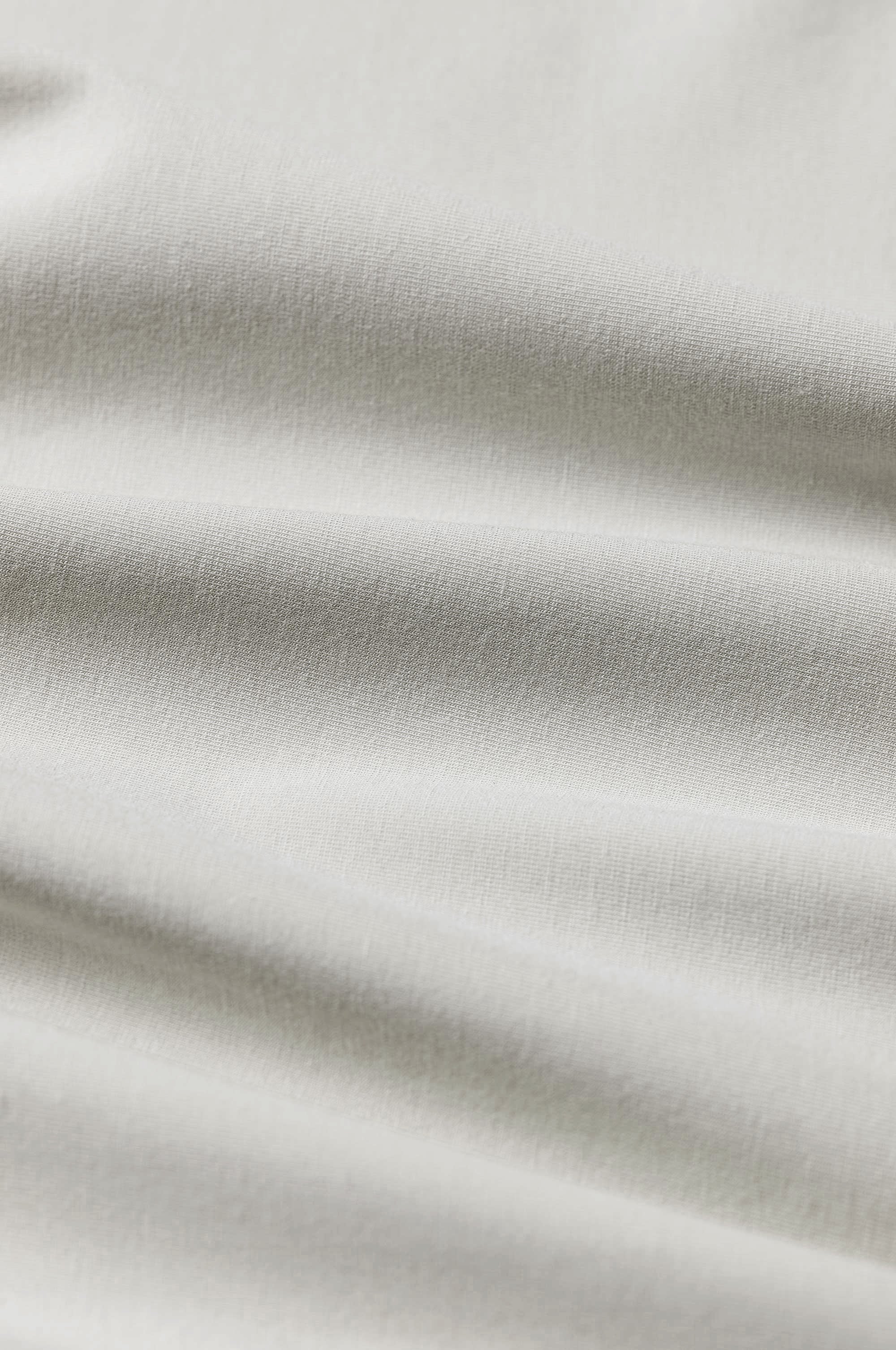 Close-up of beige fabric with subtle texture