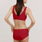 back of woman in red bra and brief