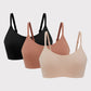 three bras in black rust color and beige