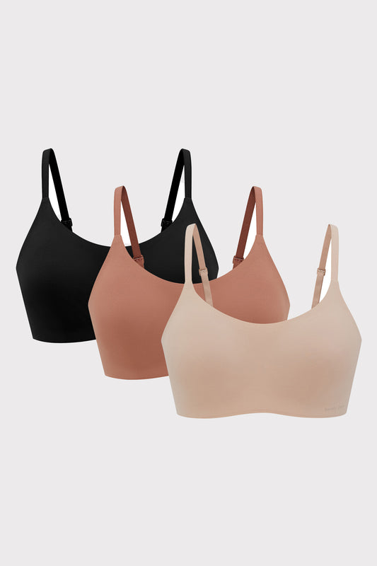three bras in black rust color and beige