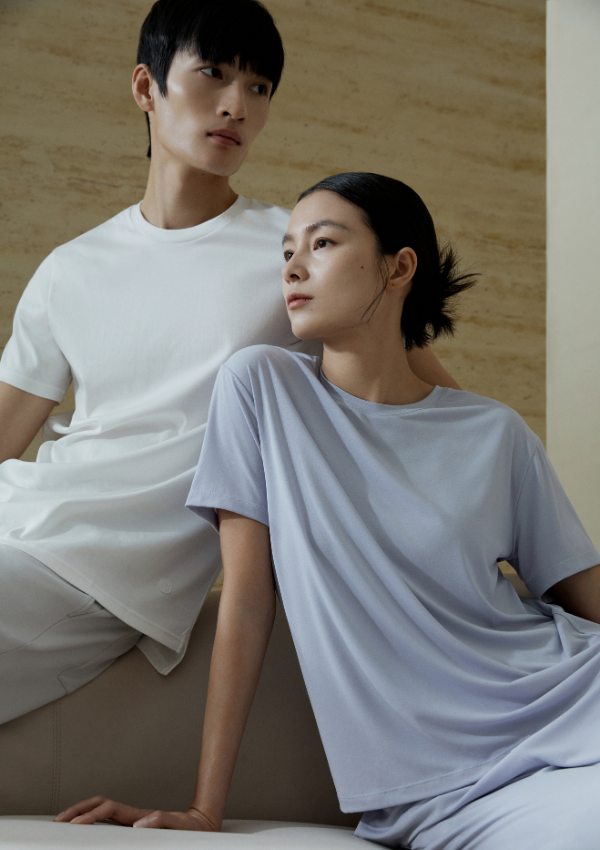 a woman in the front wearing blue top and a man in the back wearing white top