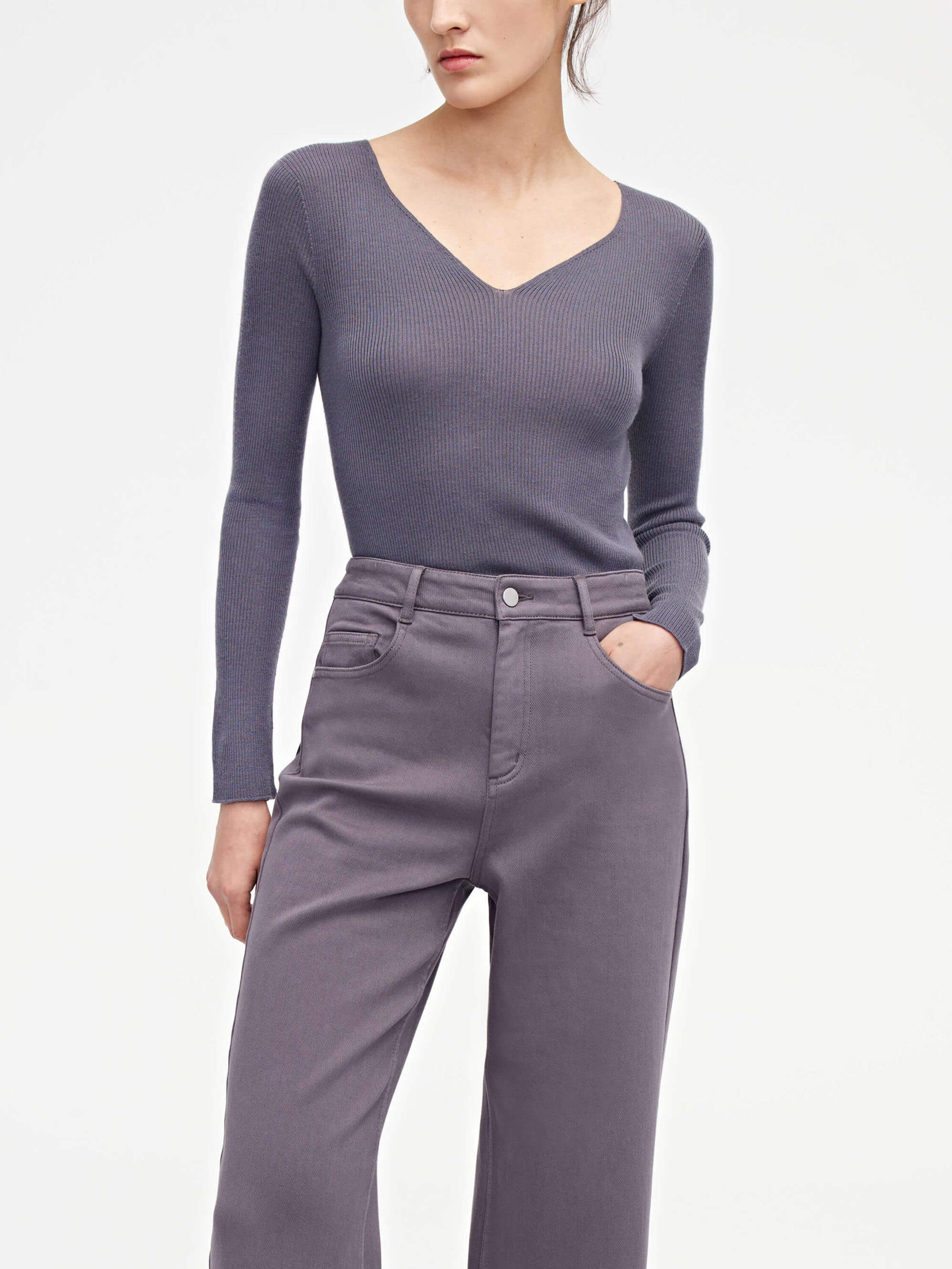 woman in purple v neck sweater