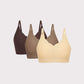 three bras in black, light brown and beige