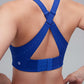 back of woman in blue sports bra