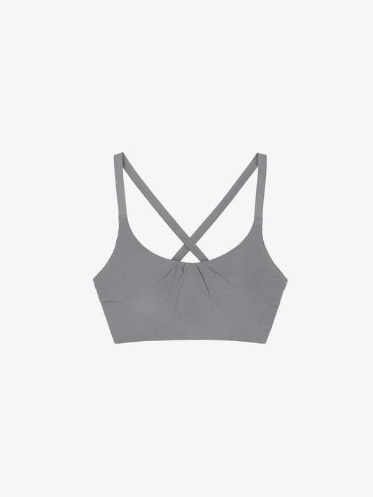 Flat lay of dark gray cross back sports bra