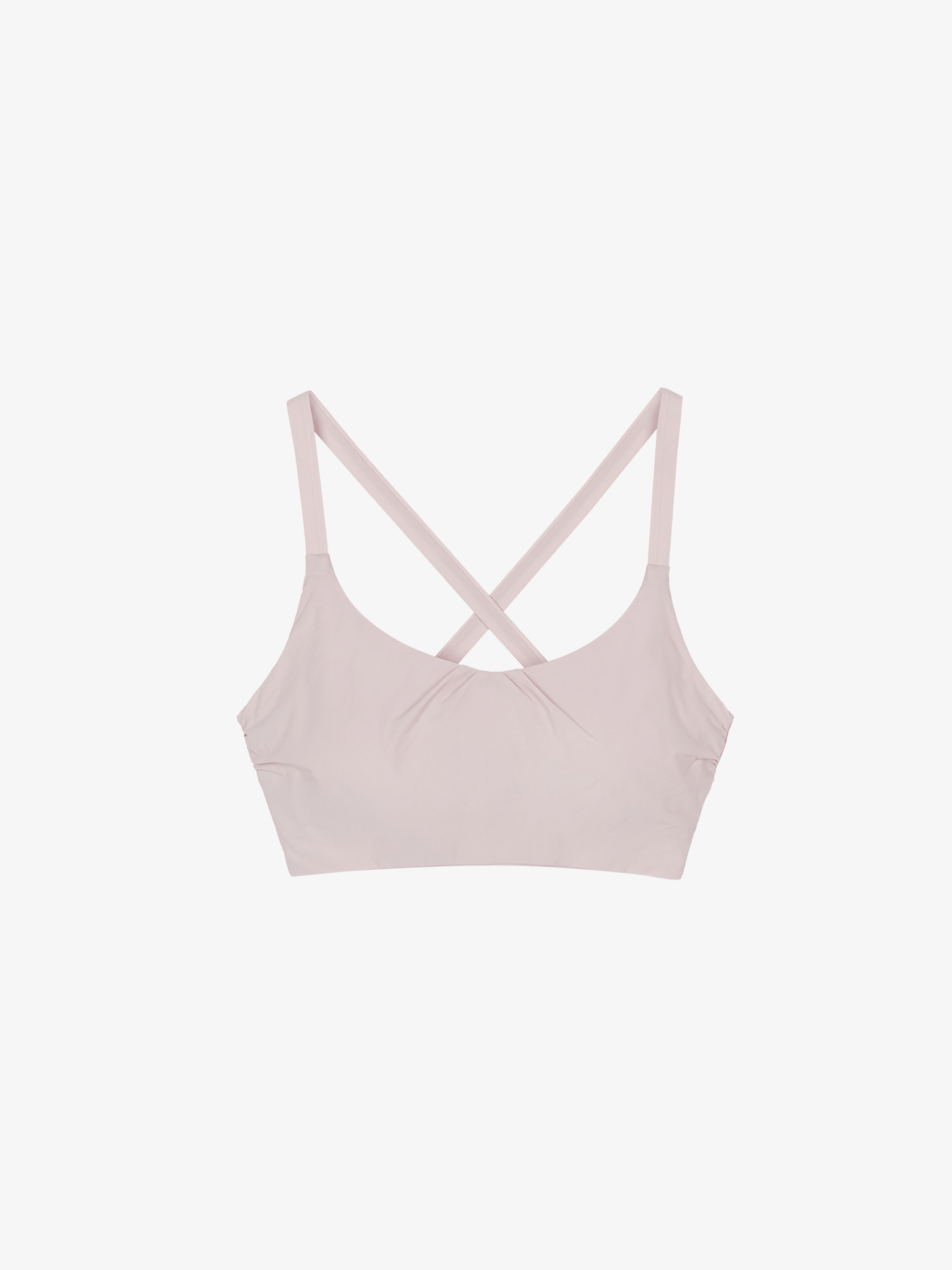 Flat lay of light pink cross back sports bra