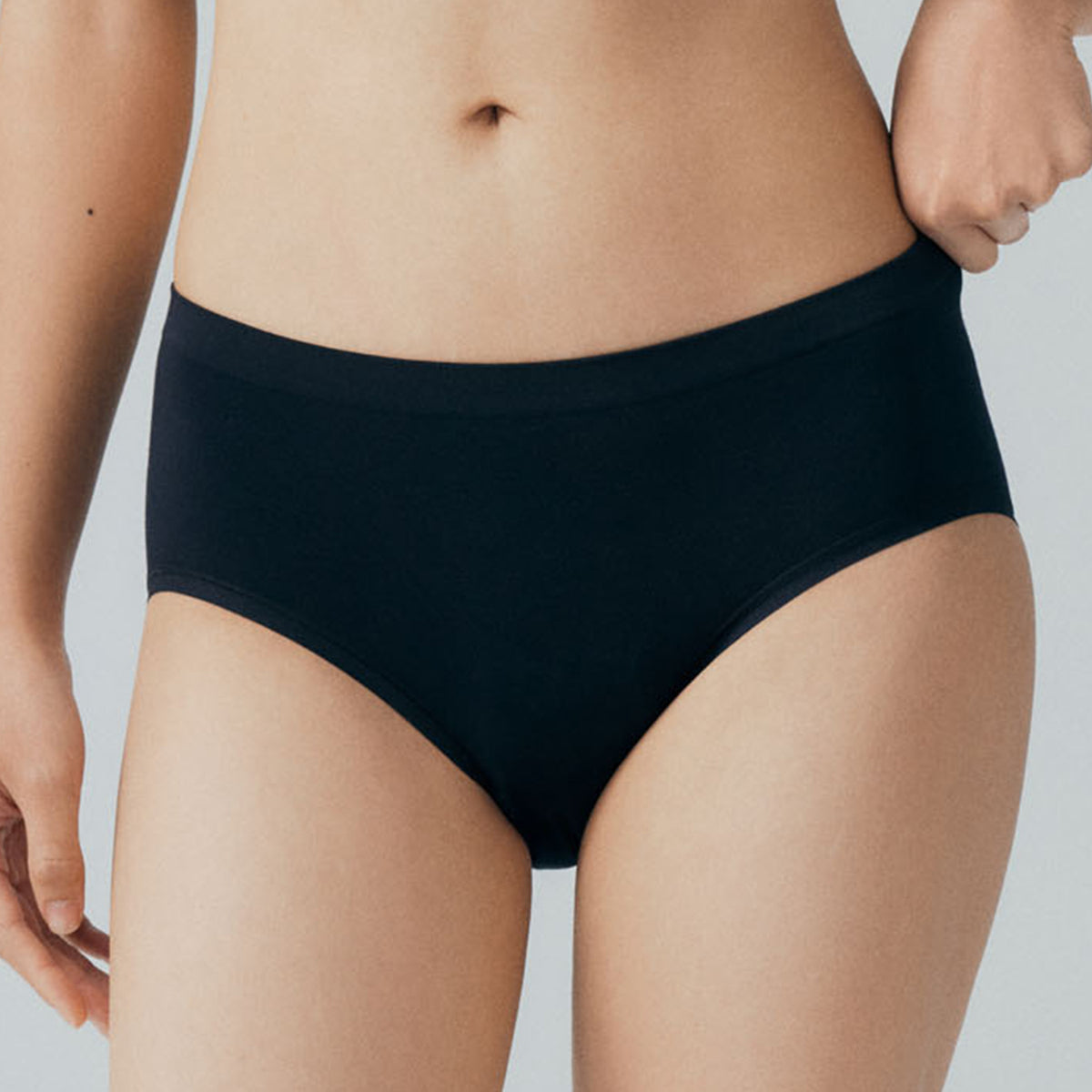 a woman wearing a pair of black panties
