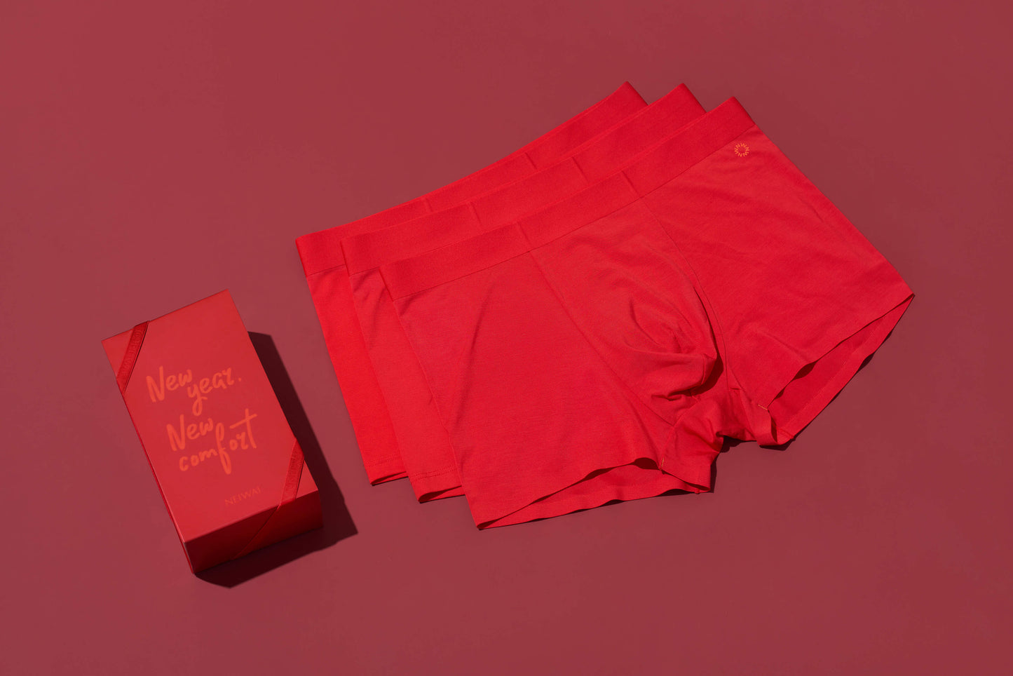 three red men's briefs and a red gift box