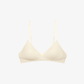 Flat lay of cream colored bra.