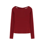 Flat lay of red long sleeve top