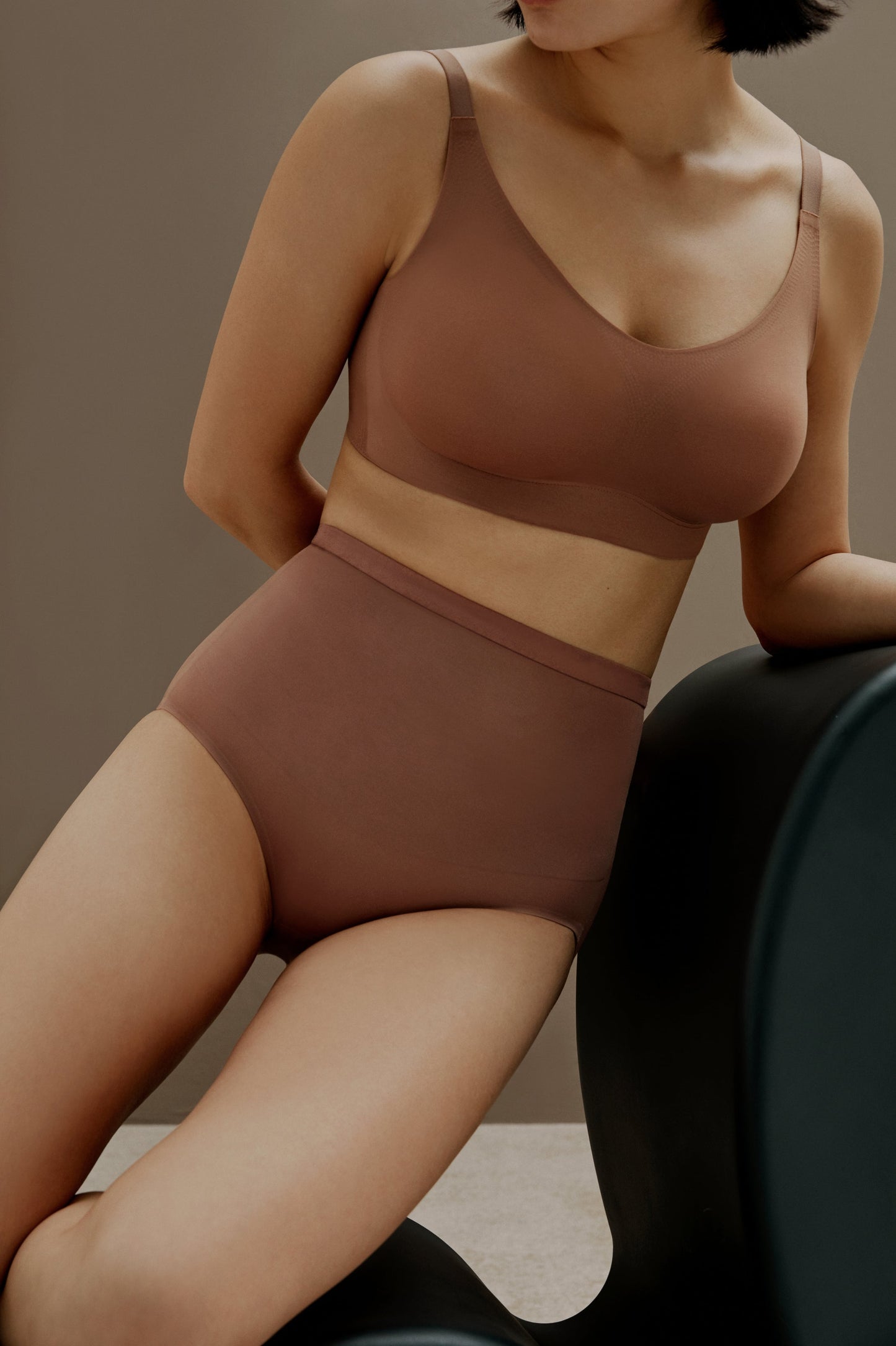 woman in brick color bra and brief