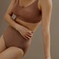 woman in brick color bra and brief