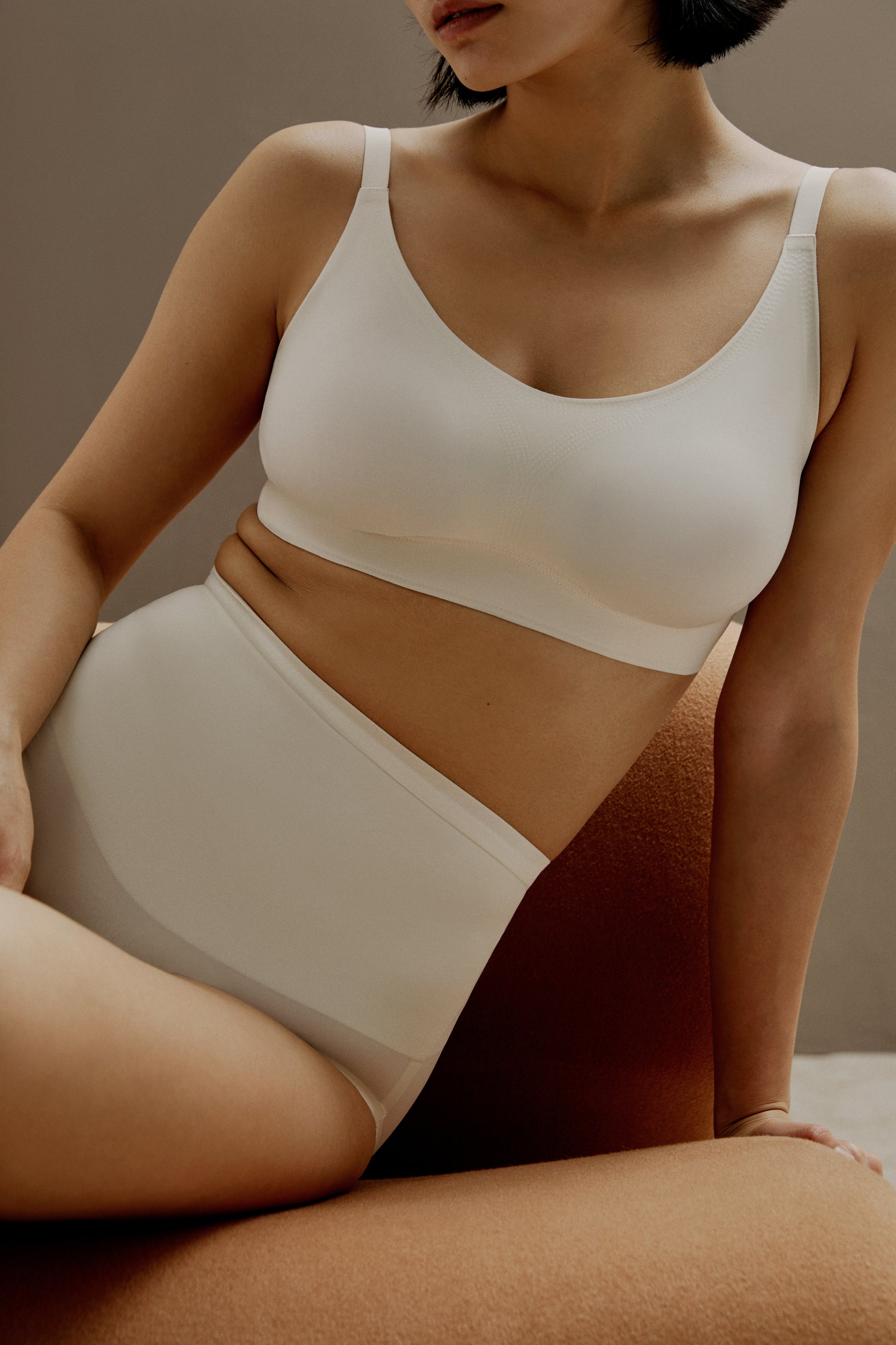 woman wearing off white bra and matching panties. Vanilla Bean color.