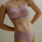Woman wearing spaghetti strap pullover bra in lavender and matching underwear