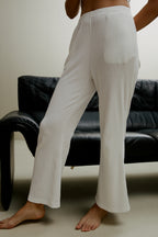 Women in the white ribbed pajama pants