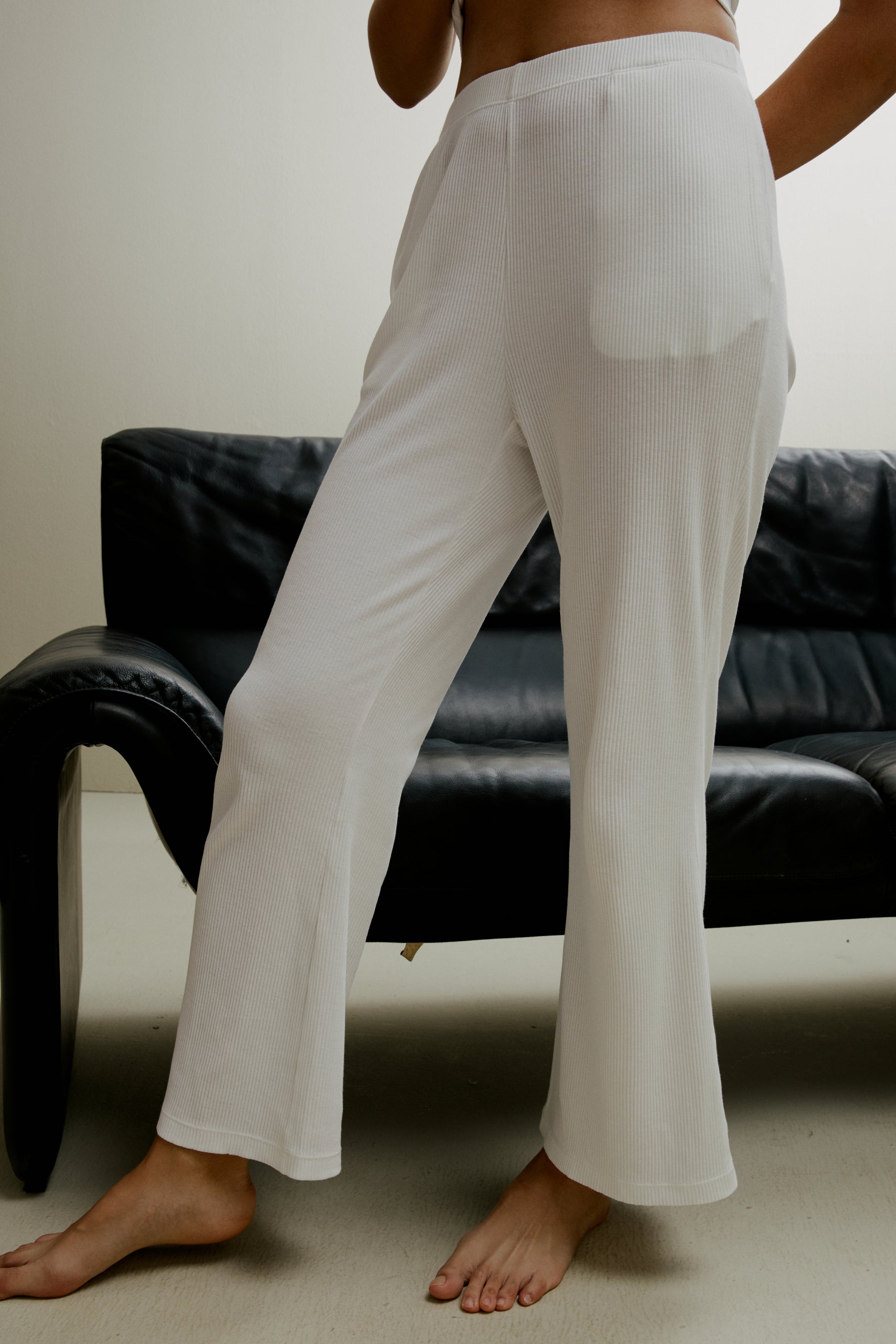 Women in the white ribbed pajama pants