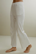 Women in the white ribbed pajama pants