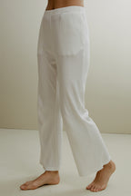 Women in the white ribbed pajama pants