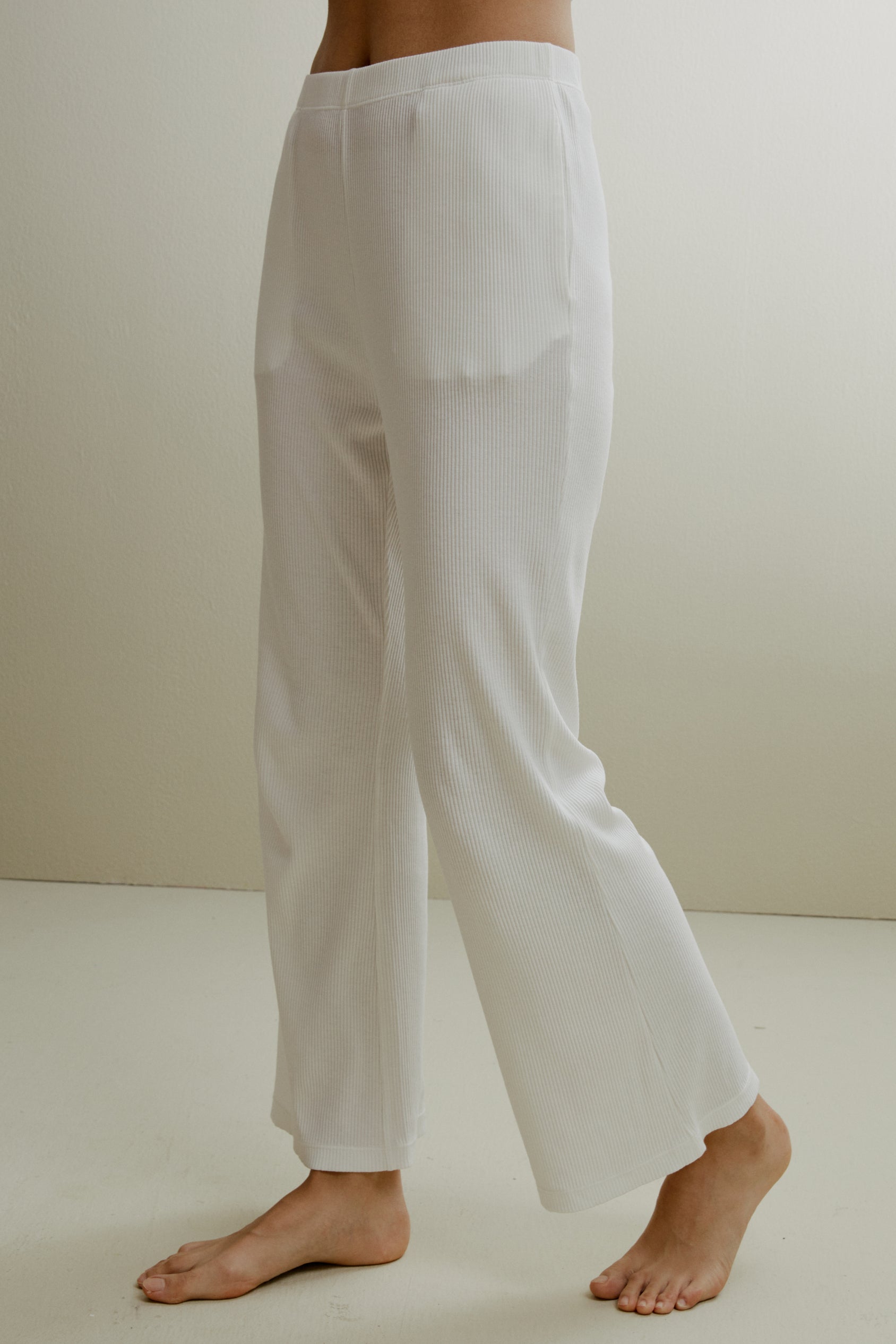 Women in the white ribbed pajama pants