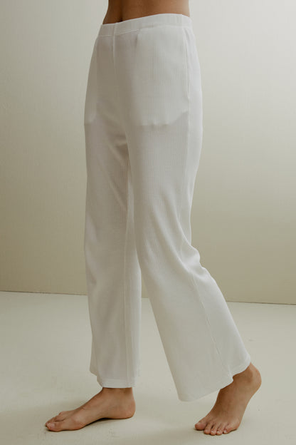 Women in the white ribbed pajama pants