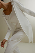 side of women in white ribbed cardigan and pajamas set
