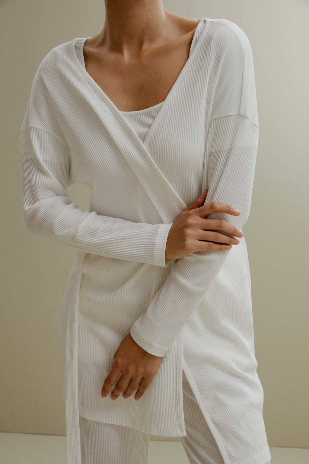 women in white ribbed cardigan and pajamas set