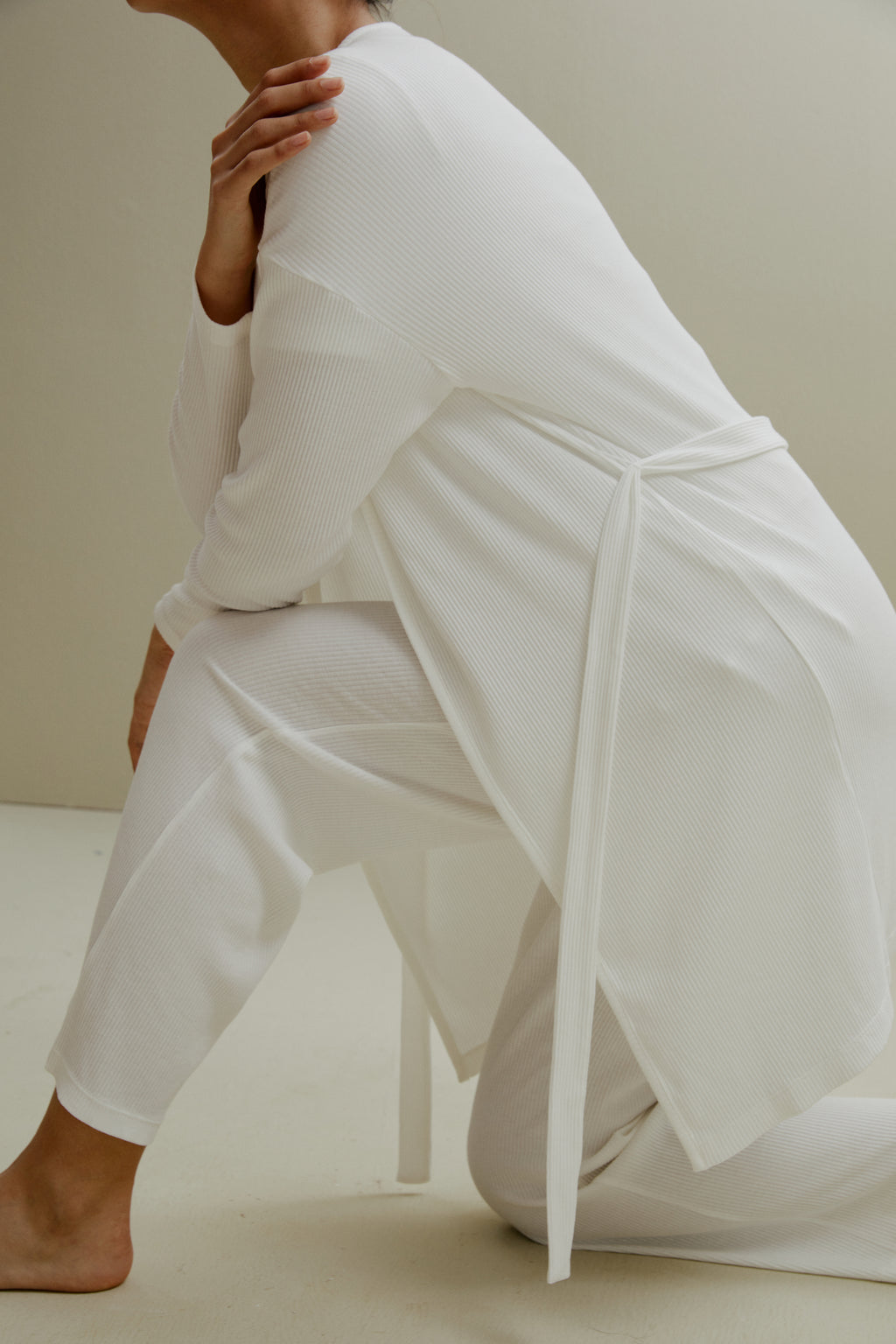 side of women in white ribbed cardigan and pajamas set