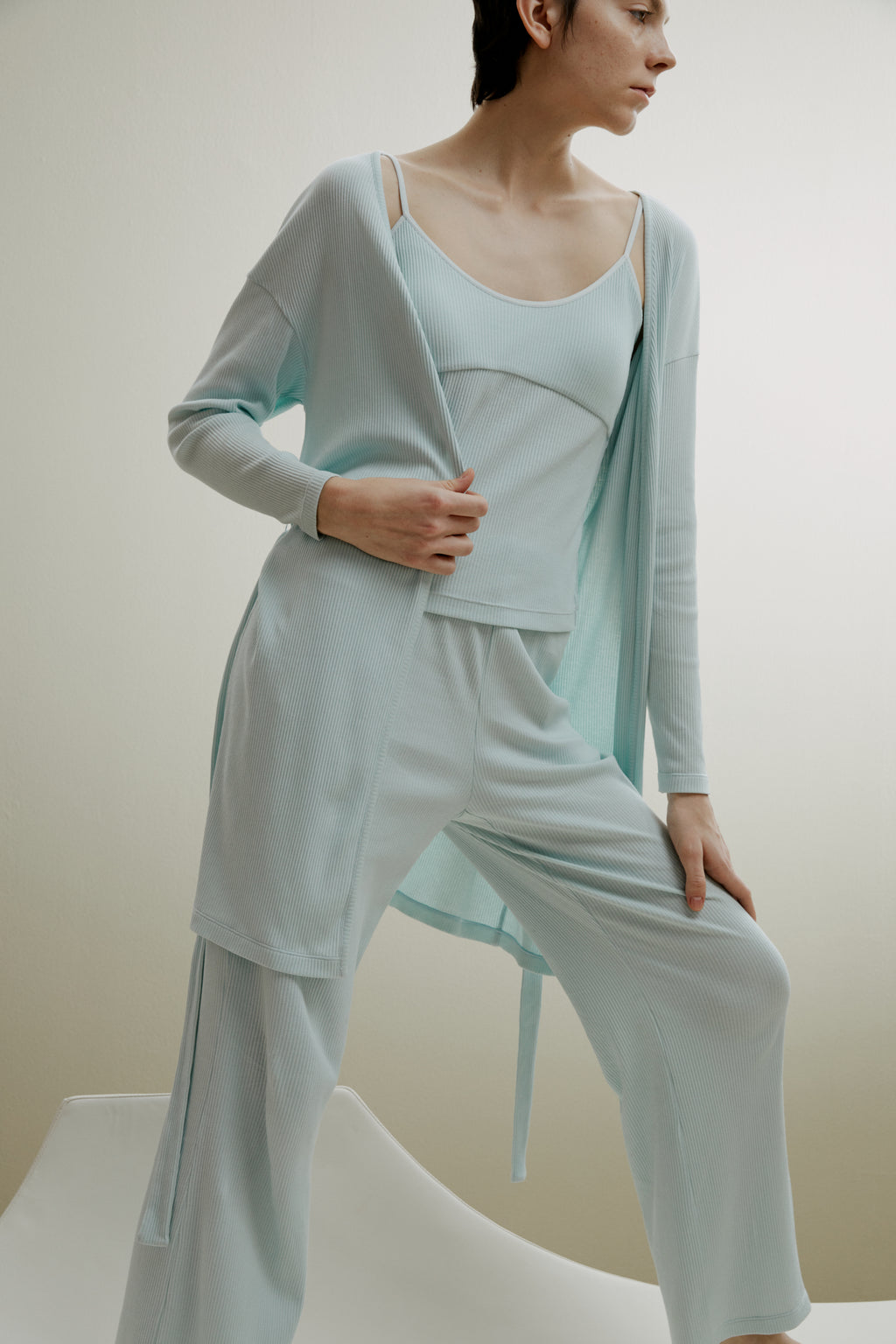 women in pale blue ribbed cardigan and pajamas set