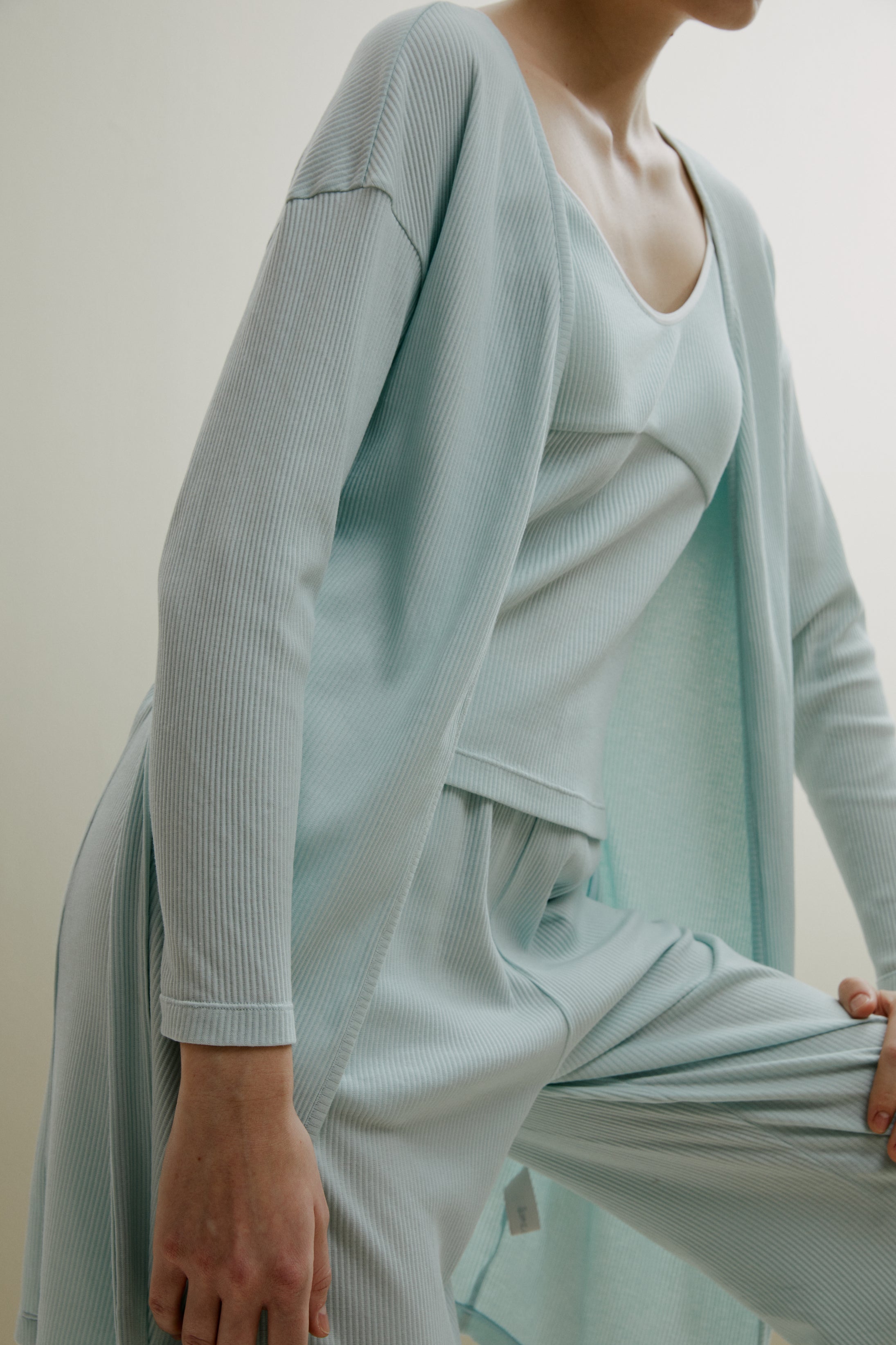 side of women in pale blue ribbed cardigan and pajamas set