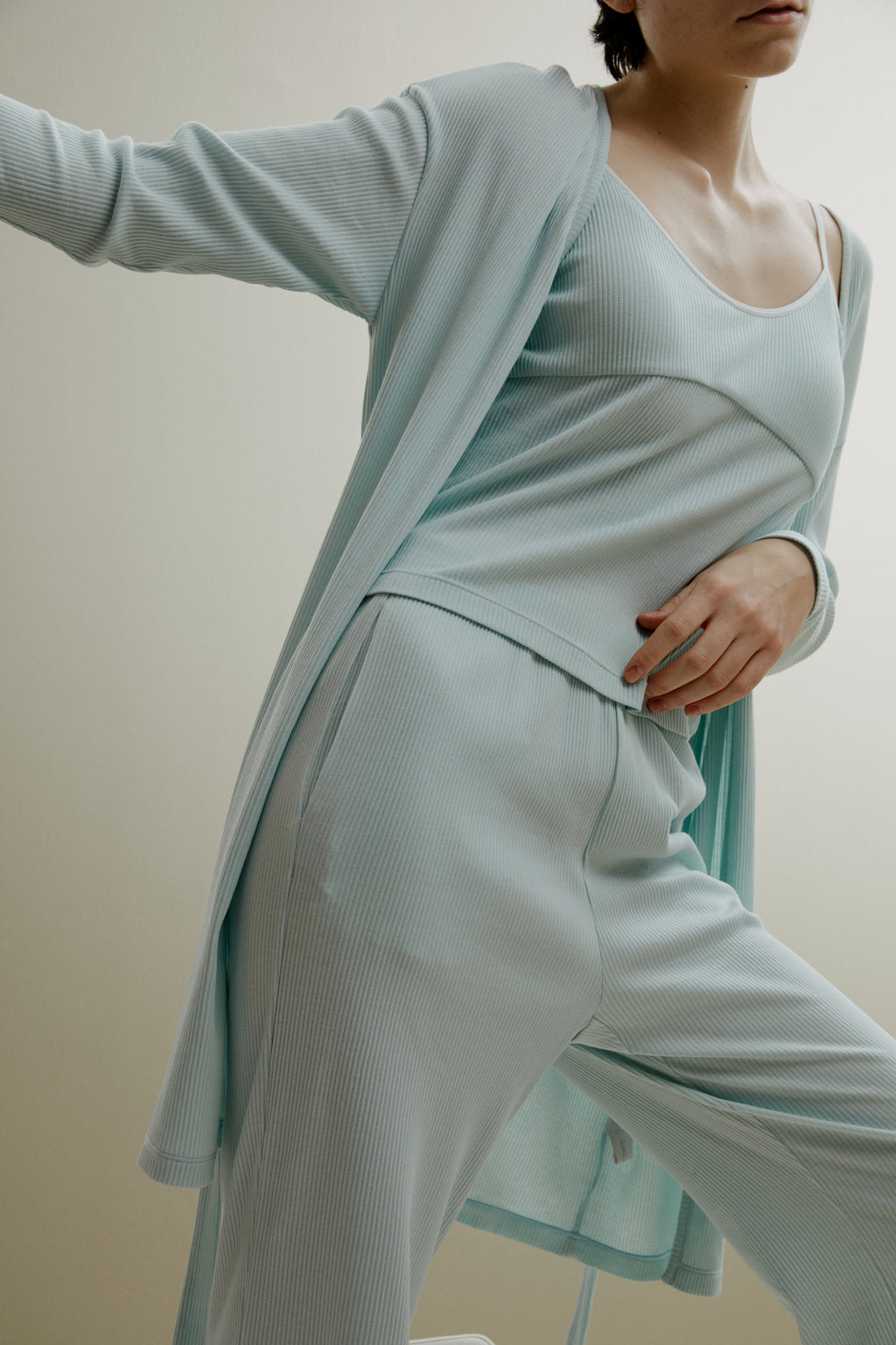 women in pale blue ribbed cardigan and pajamas set