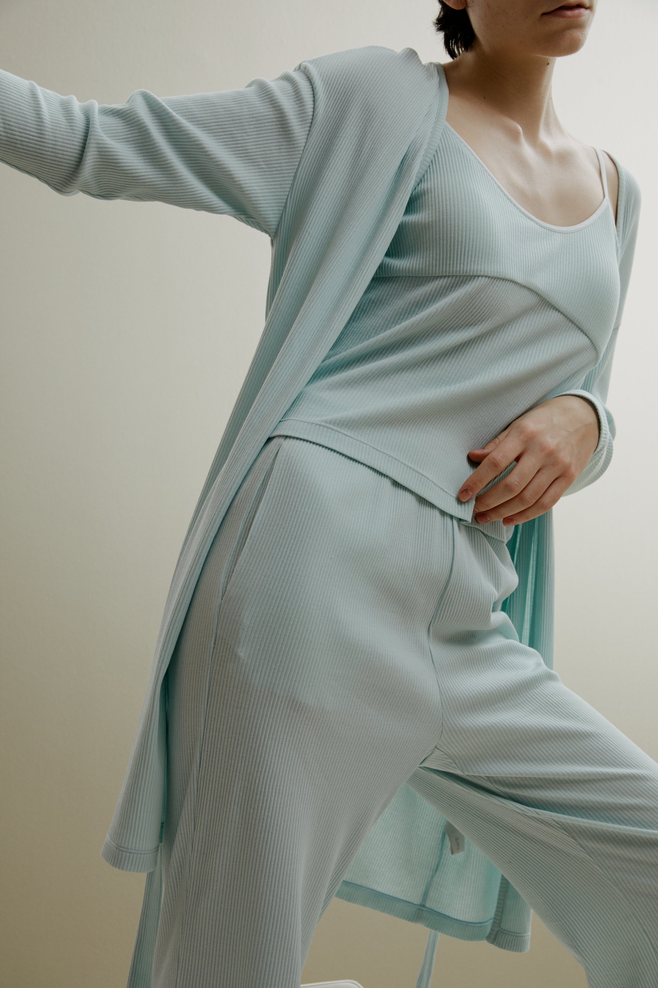 women in pale blue ribbed cardigan and pajamas set