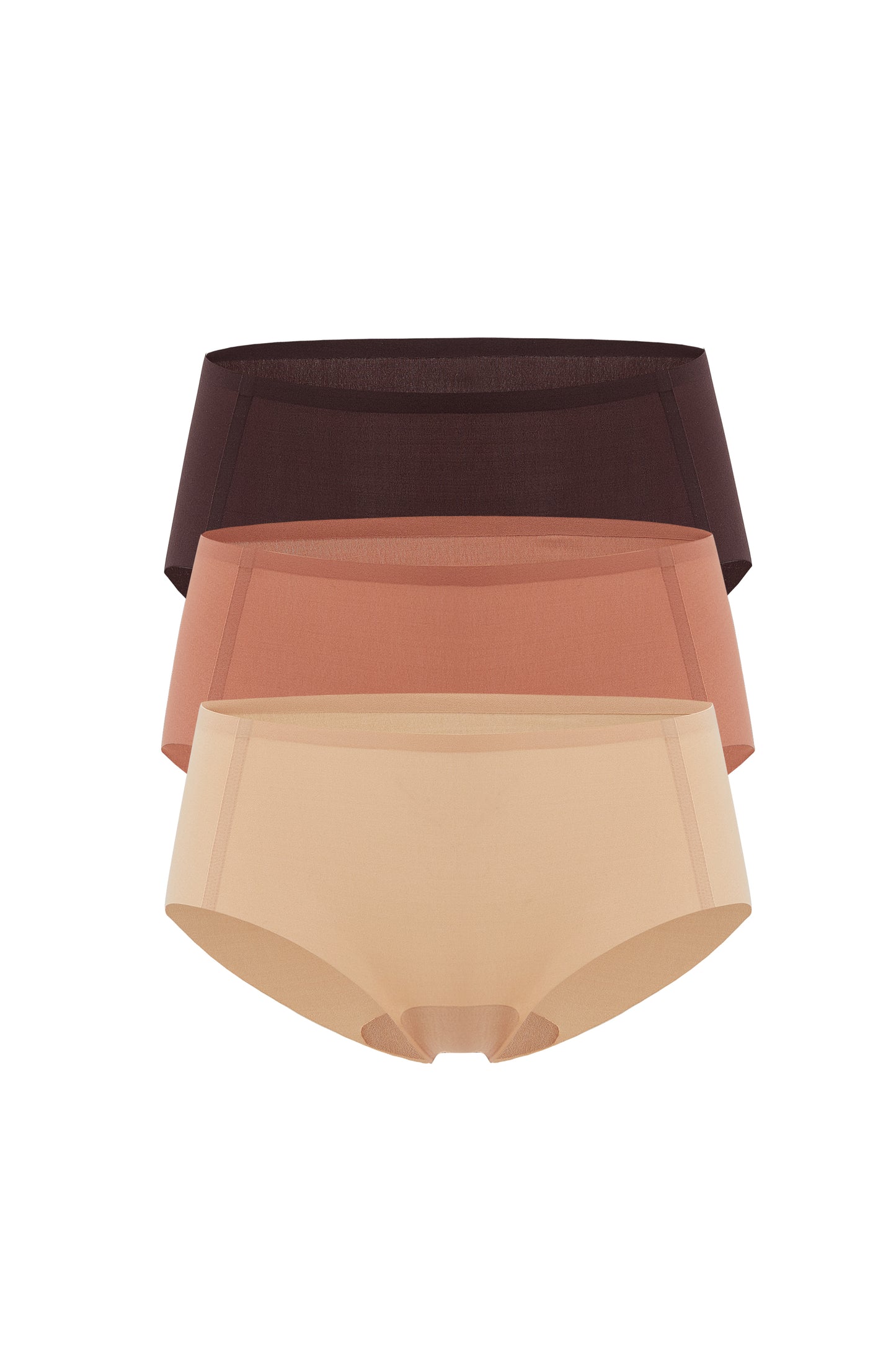 Flat lay image of tan underwear, rust-colored underwear, and brown underwear
