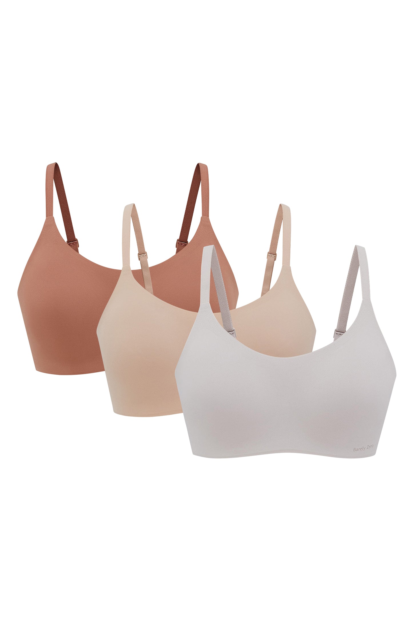 three bras in off white, rust color and beige