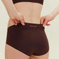 back of woman in brown underwear with Barely Zero printed at the waist