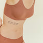 woman in rust color bra and brief