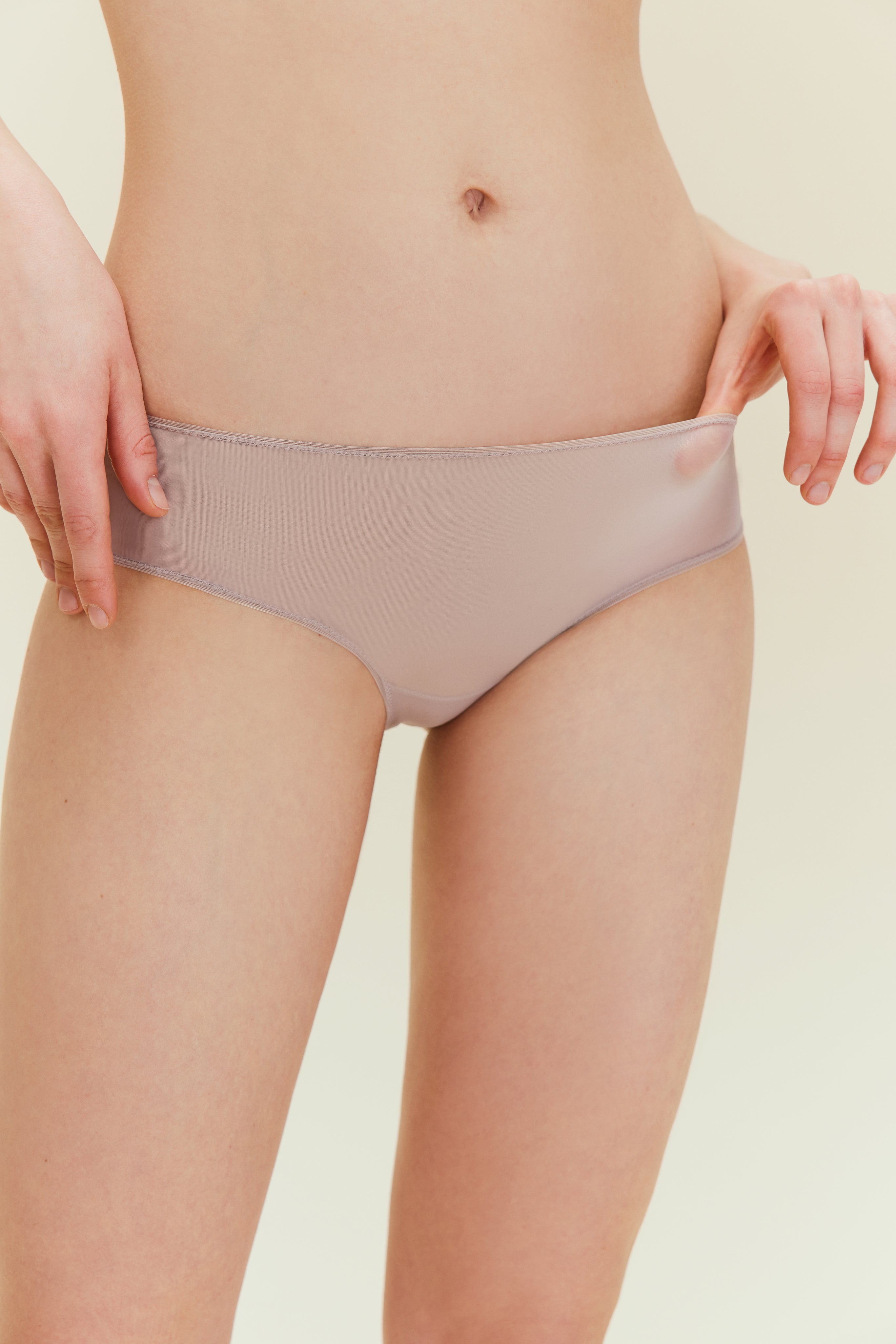 Woman wearing taupe brief.