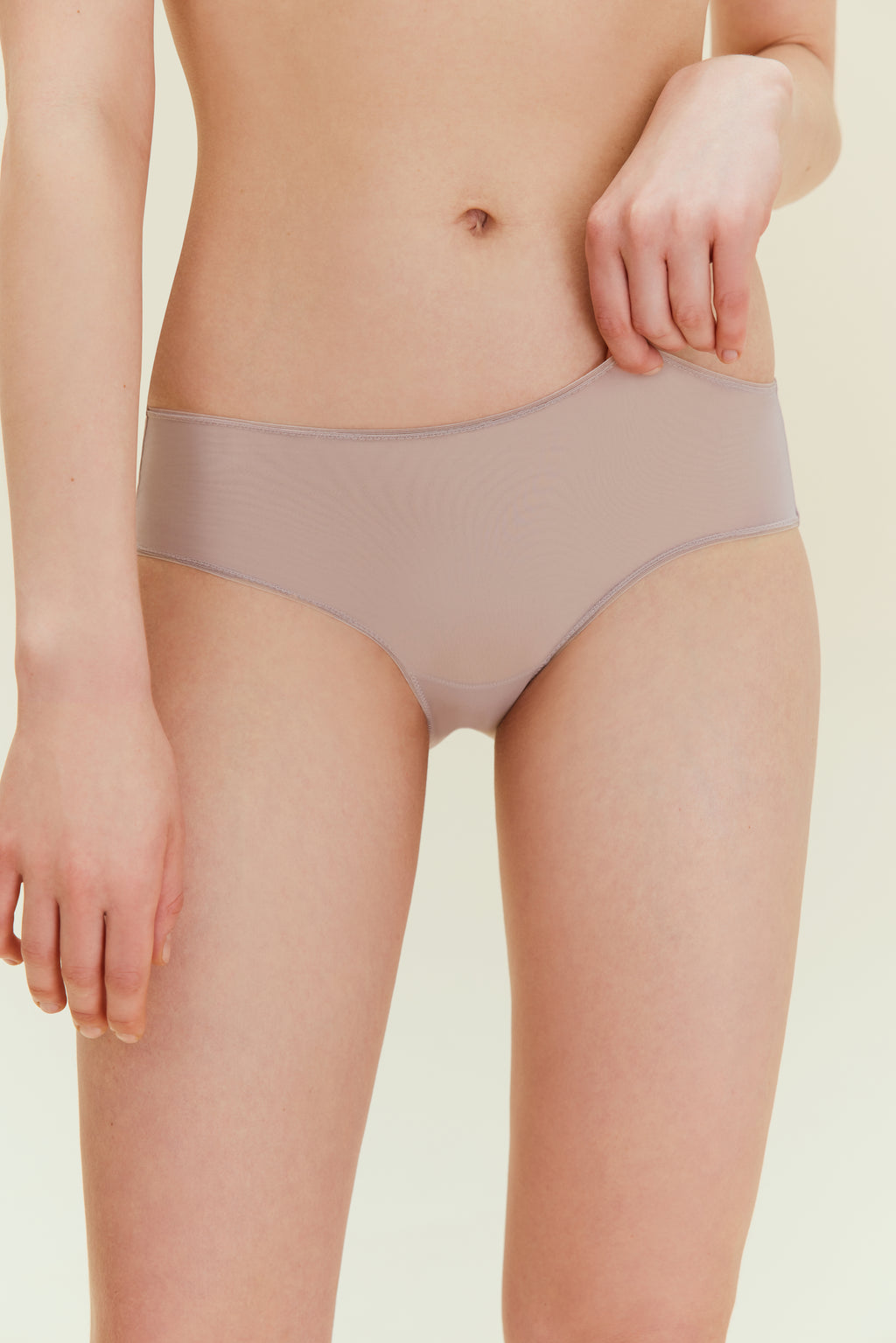 Front view of woman in taupe brief.