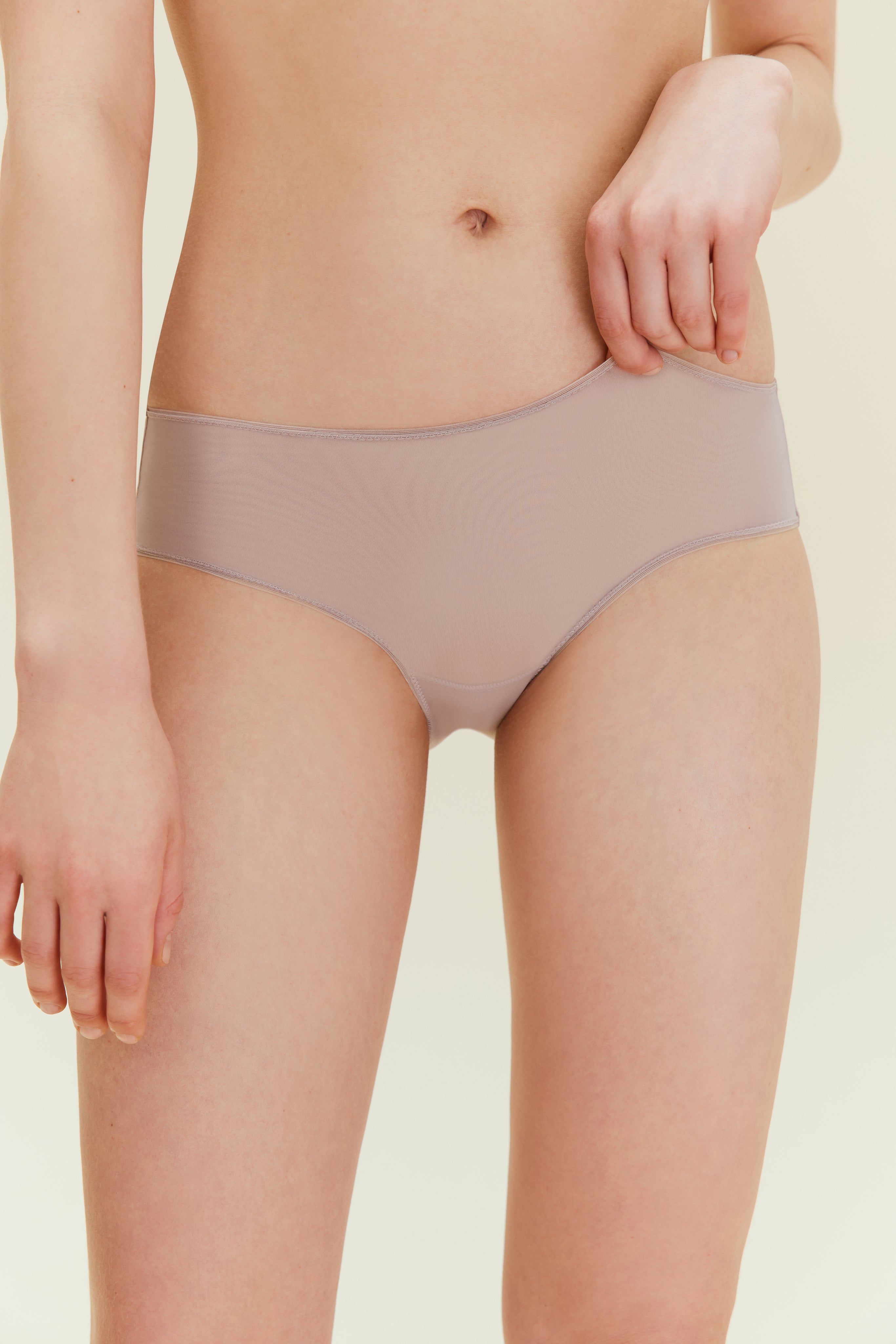 Front view of woman in taupe brief.