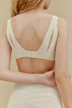 back of woman in white bra and underwear