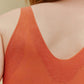 back of woman in orange bra