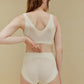 back of woman in white bra and brief