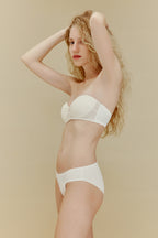 side of woman in white bra and underwear