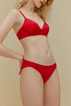 woman in red silk bra and underwear