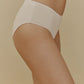 side of woman in cream brief
