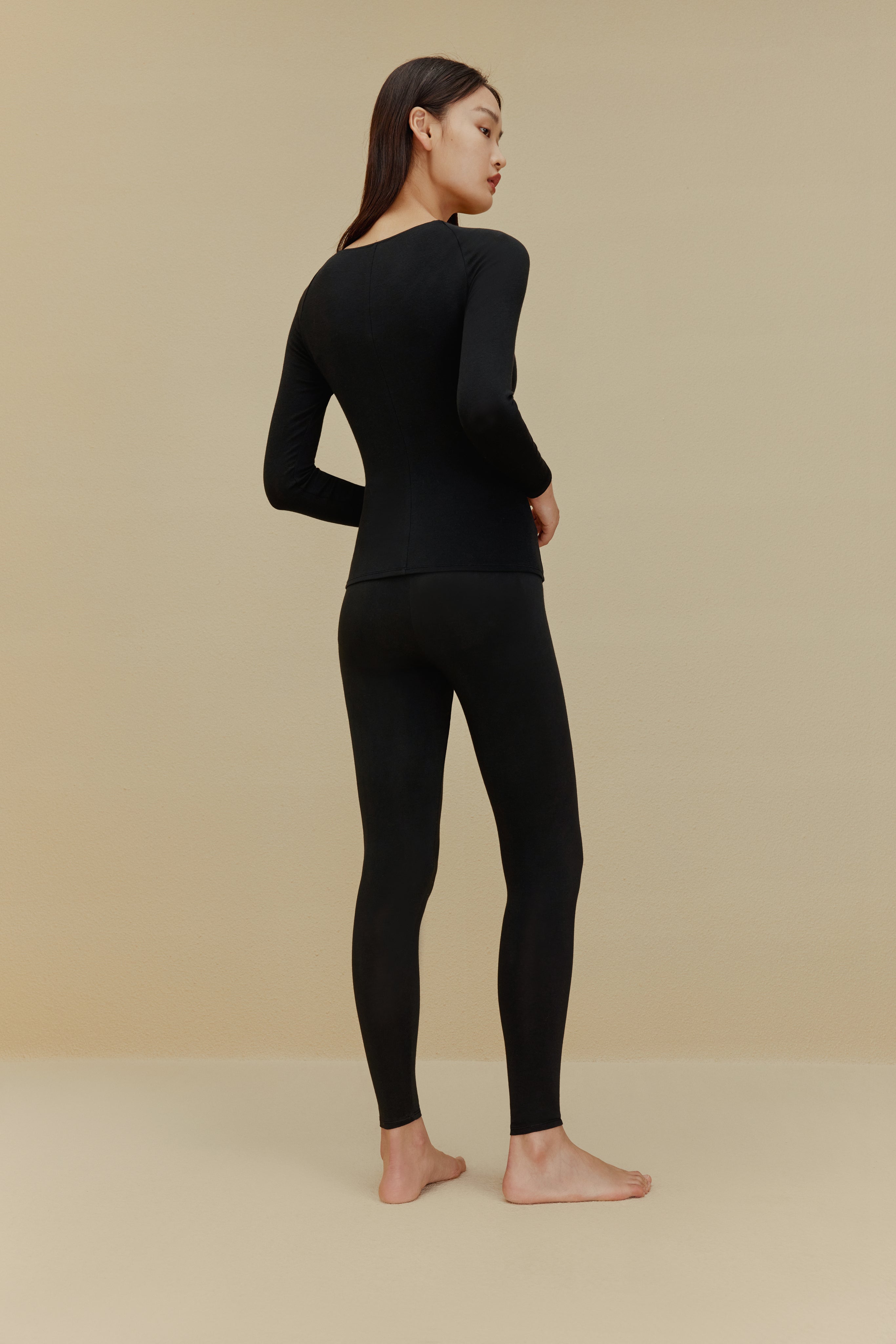 back of women in black Cashmere Thermal Underwear set