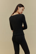 back of women in black thermal underwear set