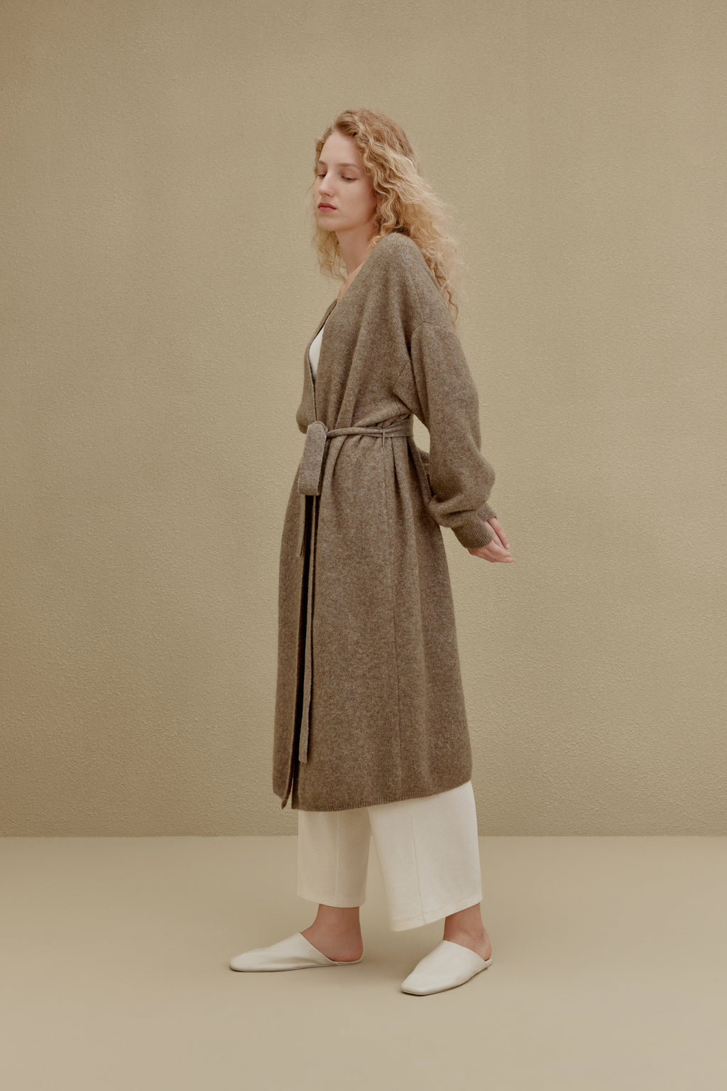 woman in brown long knitted coat