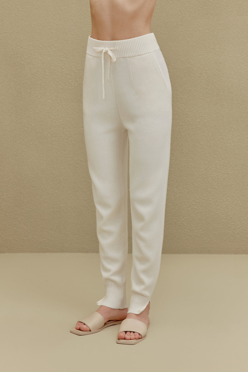 women in white knitted joggers