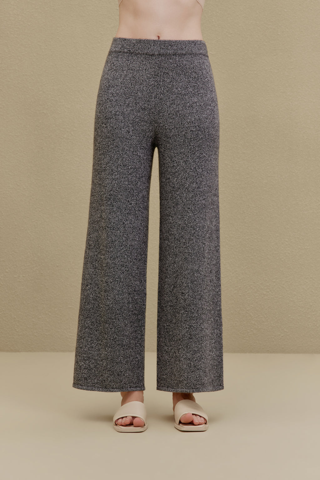 Woman in black wide-leg pants