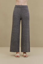 Woman in black wide-leg pants